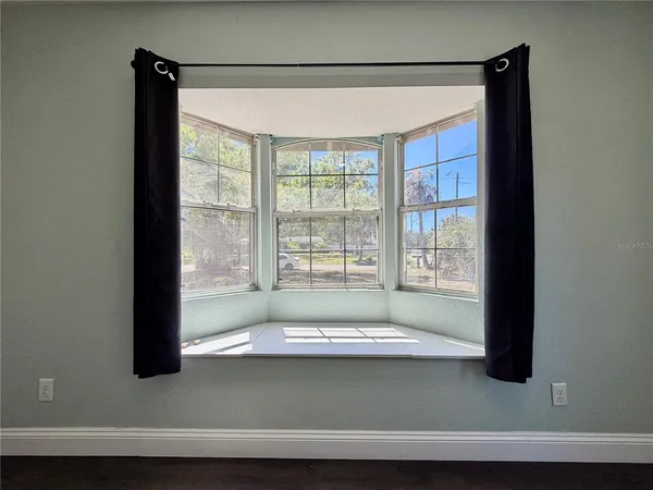 a bathroom with a bathtub and a window
