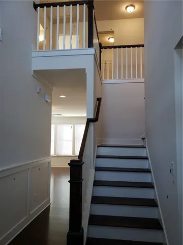 a bathroom with a shower a toilet and a sink