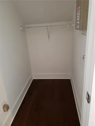 a view of a room with wooden floor