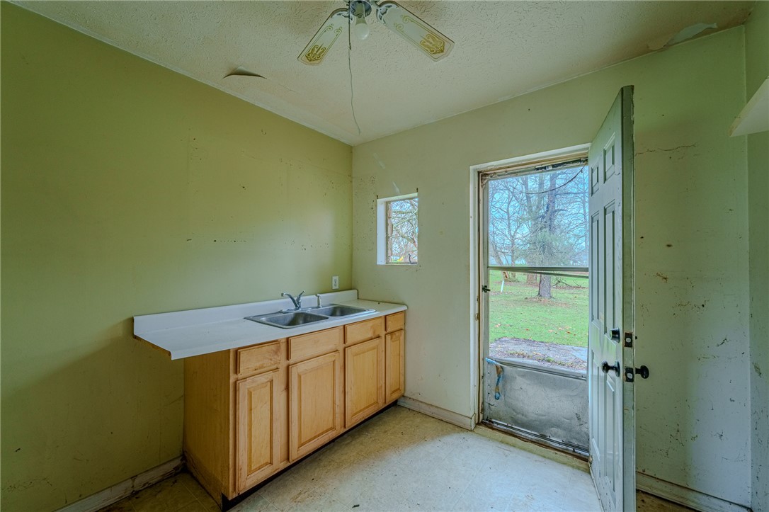 5839 Shaker Road Franklin, OH 45005 - Photo 6 of 18 This functional utility room offers direct outdoor access and convenient laundry amenities.