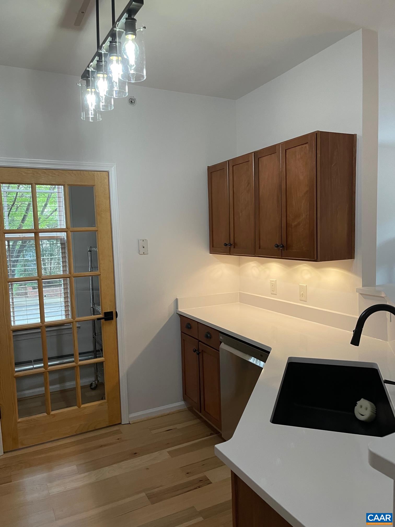710 Walker Square, Unit 2B Charlottesville, VA 22903 - Photo 2 of 11 a kitchen with a sink and a stove top oven