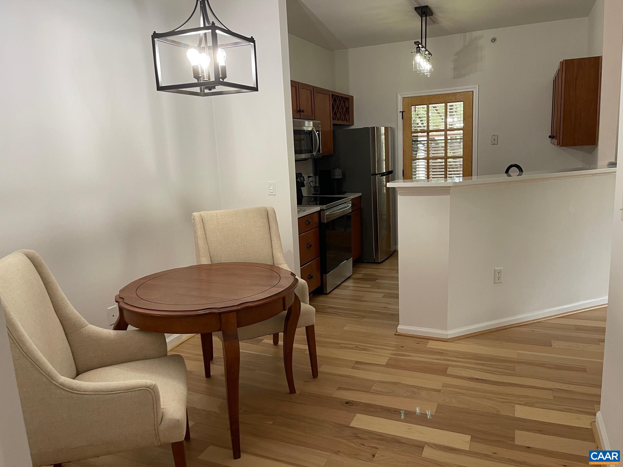 710 Walker Square, Unit 2B Charlottesville, VA 22903 - Photo 7 of 11 a living room with furniture and a flat screen tv