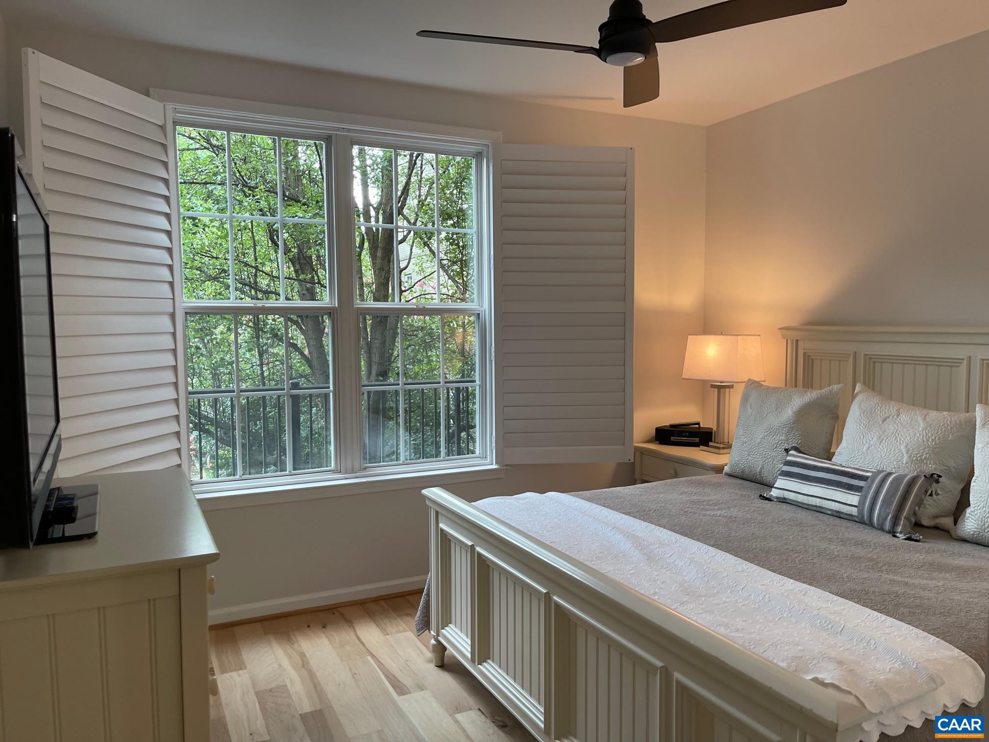 710 Walker Square, Unit 2B Charlottesville, VA 22903 - Photo 8 of 11 a bedroom with a large bed and a large window