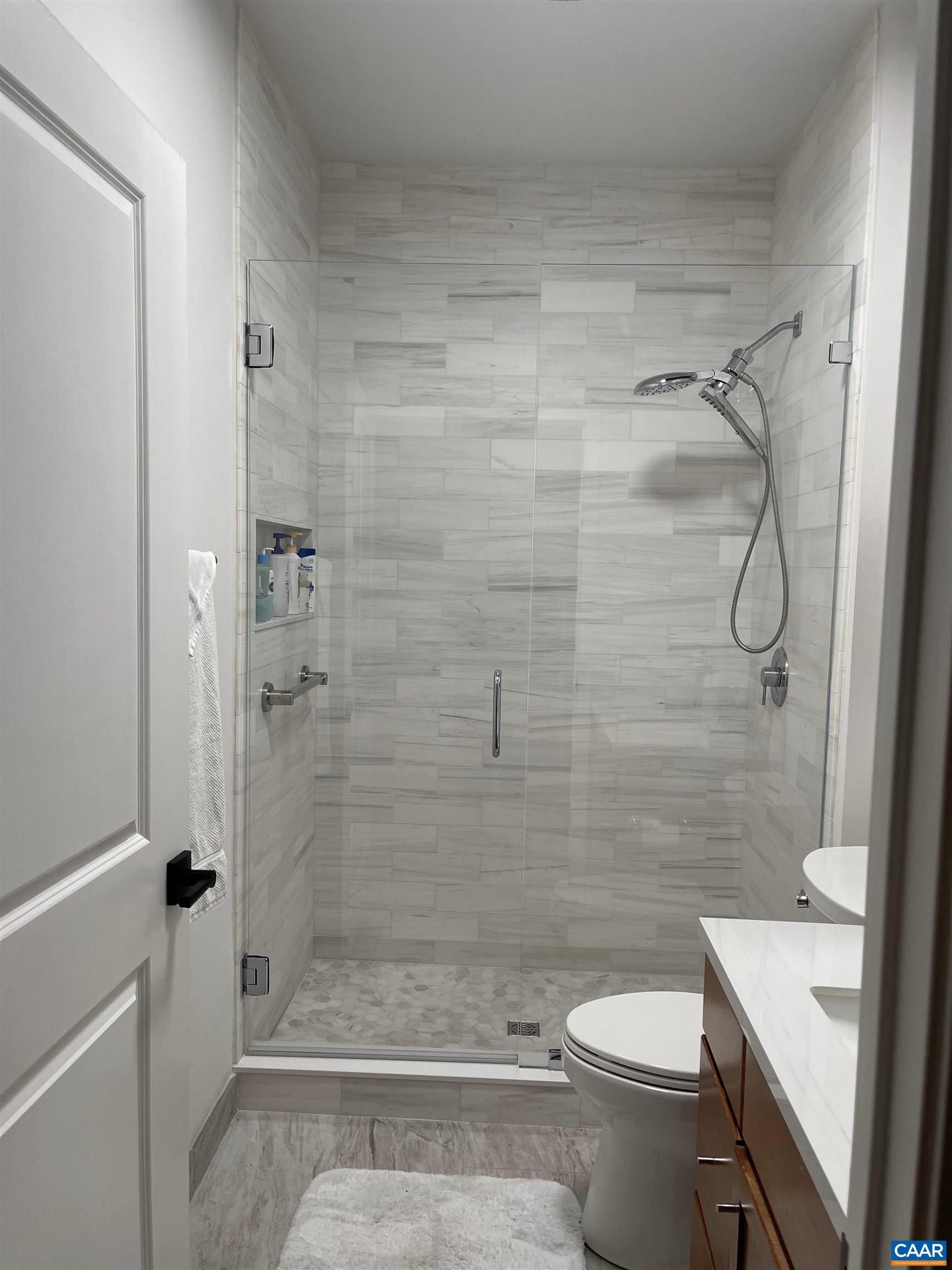 710 Walker Square, Unit 2B Charlottesville, VA 22903 - Photo 10 of 11 a bathroom with a shower a toilet and a sink