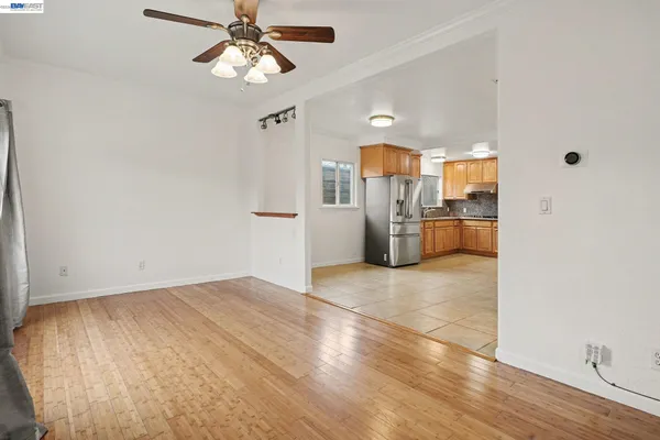 a view of a kitchen with a sink and a refrigerator