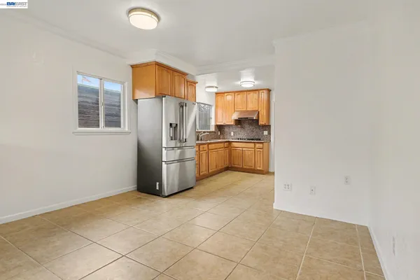 a kitchen with cabinets and stainless steel appliances