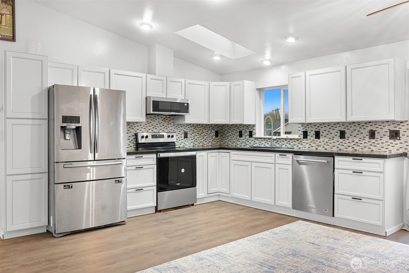 512 Allison Way Nooksack, WA 98276 - Photo 11 of 37 a kitchen with stainless steel appliances granite countertop a refrigerator stove a sink and white cabinets