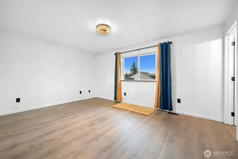 a view of a small space with wooden floor