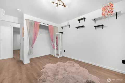 an empty room with a empty space and windows