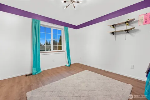 a view of an empty room with glass door