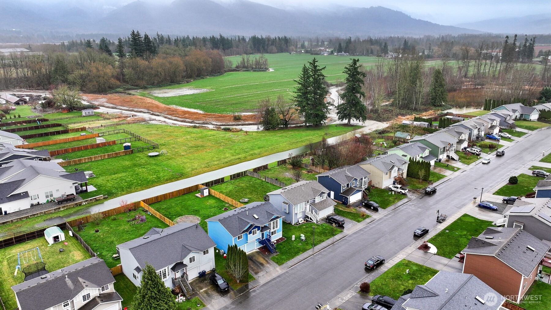 512 Allison Way Nooksack, WA 98276 - Photo 37 of 37 an aerial view of green landscape with trees houses and lake view