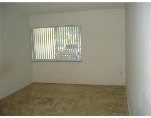 711 North Pine Island Road, Unit 103 Plantation, FL 33324 - Photo 5 of 8 Master Bedroom