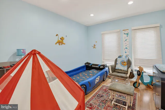 a bed room with furniture and a window