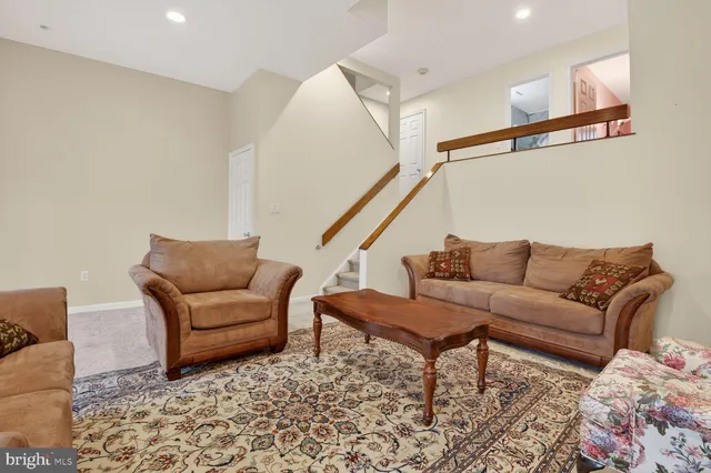 a living room with furniture and a rug