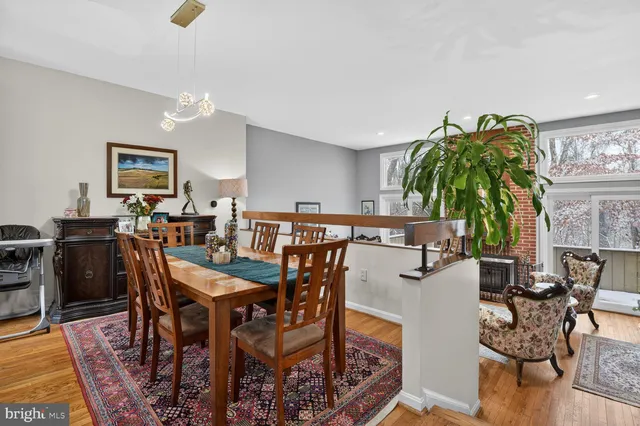 a dining room with furniture and wooden floor