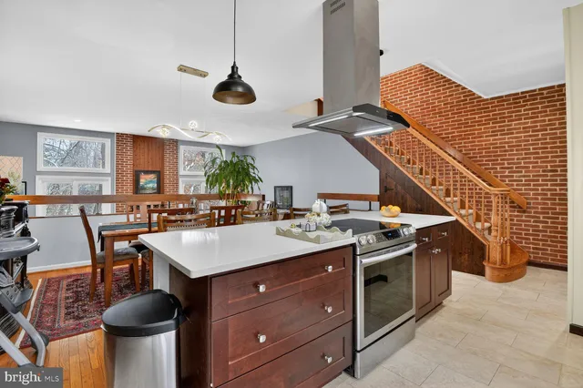a kitchen with a stove and a sink