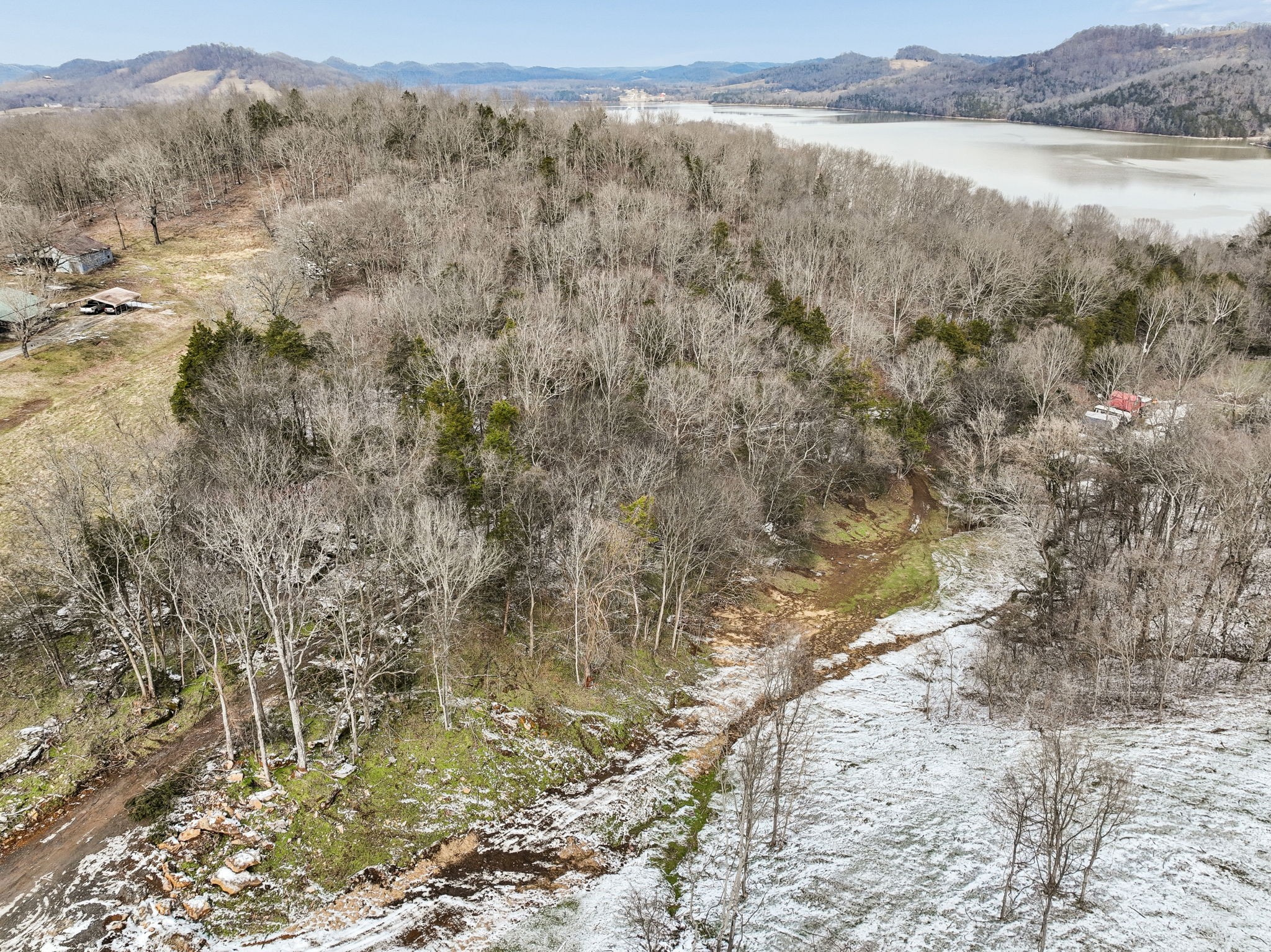 0 Sullivan Bend Road Elmwood, TN 38560 - Photo 19 of 22 a view of a lake with mountains in the background