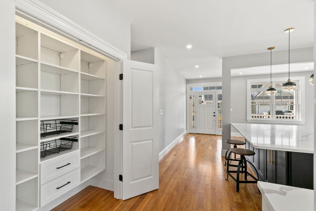 9 Adams Lane, Unit 9 Sherborn, MA 01770 - Photo 6 of 26 a living room with furniture and wooden floor