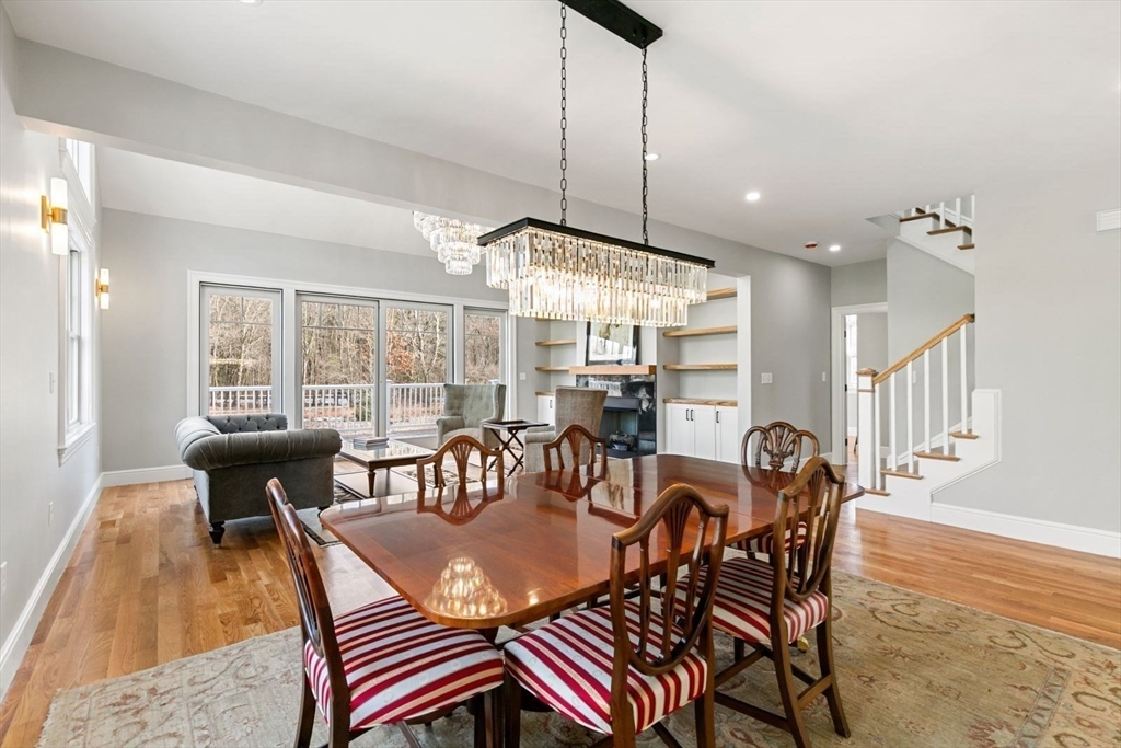 9 Adams Lane, Unit 9 Sherborn, MA 01770 - Photo 7 of 26 a view of a dining room with furniture and wooden floor