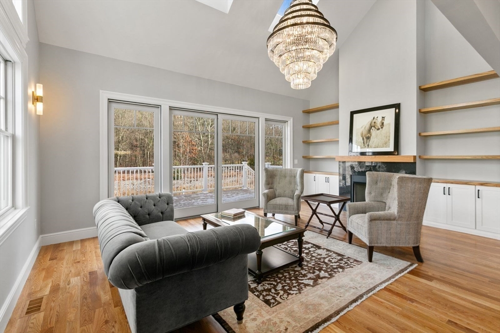 9 Adams Lane, Unit 9 Sherborn, MA 01770 - Photo 10 of 26 a living room with furniture and a window