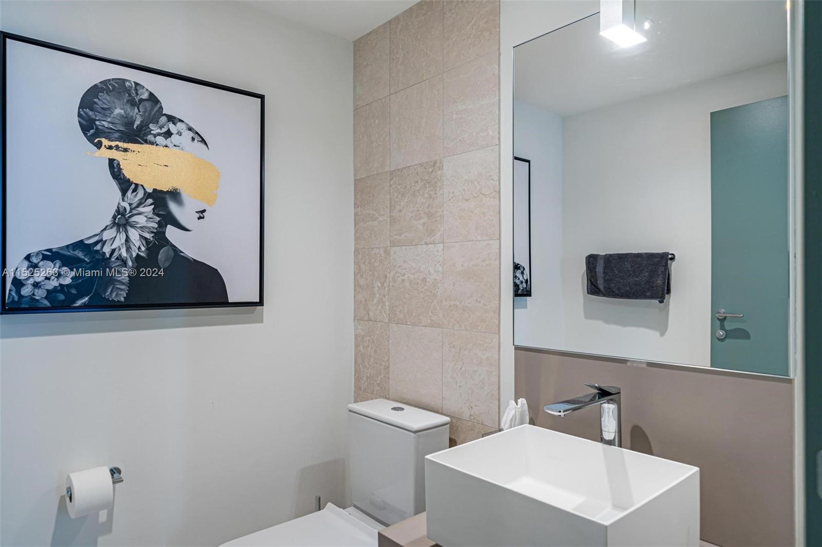 1000 Brickell Plaza, Unit 4101 Miami, FL 33131 - Photo 12 of 24 a bathroom with a toilet a sink and mirror