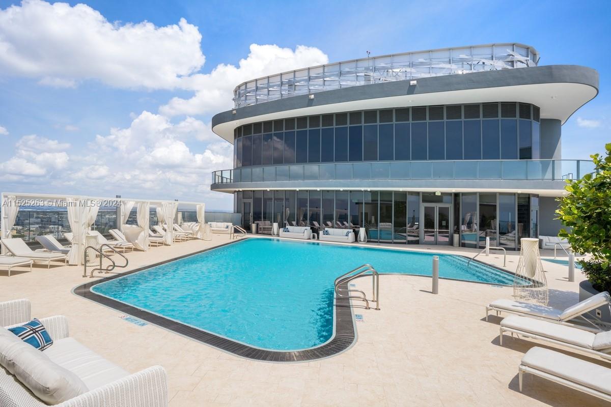 1000 Brickell Plaza, Unit 4101 Miami, FL 33131 - Photo 17 of 24 a view of a swimming pool with a patio and a yard