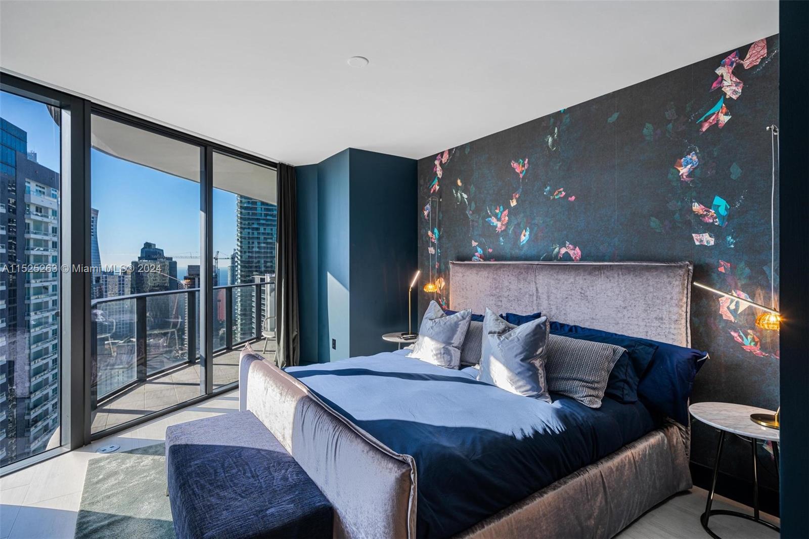 1000 Brickell Plaza, Unit 4101 Miami, FL 33131 - Photo 5 of 24 a bedroom with a large bed and a flat screen tv