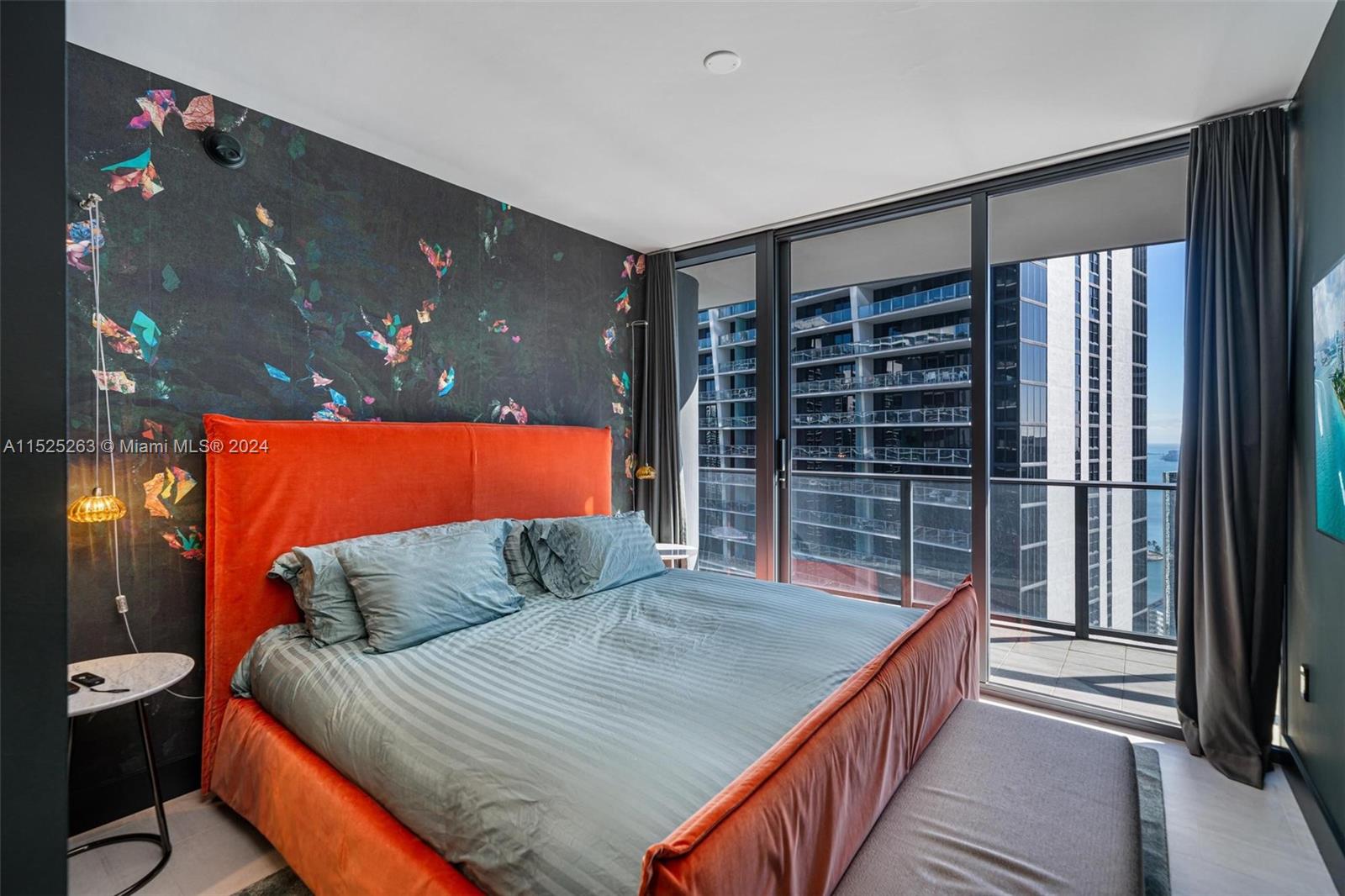 1000 Brickell Plaza, Unit 4101 Miami, FL 33131 - Photo 8 of 24 a bedroom with a bed and a walk in closet