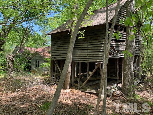 0 Paynes Tavern Road Roxboro, NC 27574 - Photo 5 of 8 a house with a tree in the back yard
