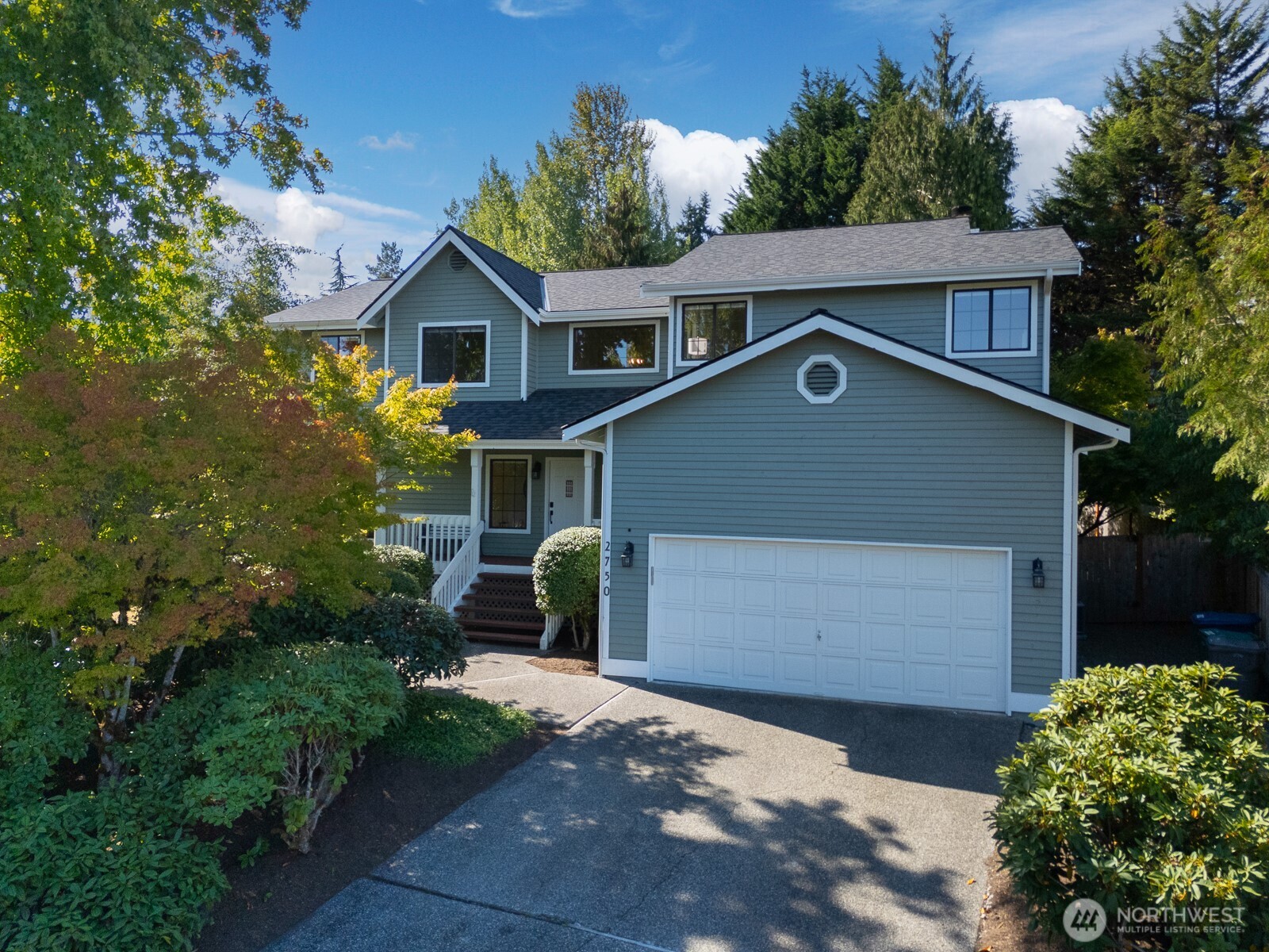 2750 214th Street Southwest Brier, WA 98036 - Photo 1 of 39 a front view of a house with a yard and a garage