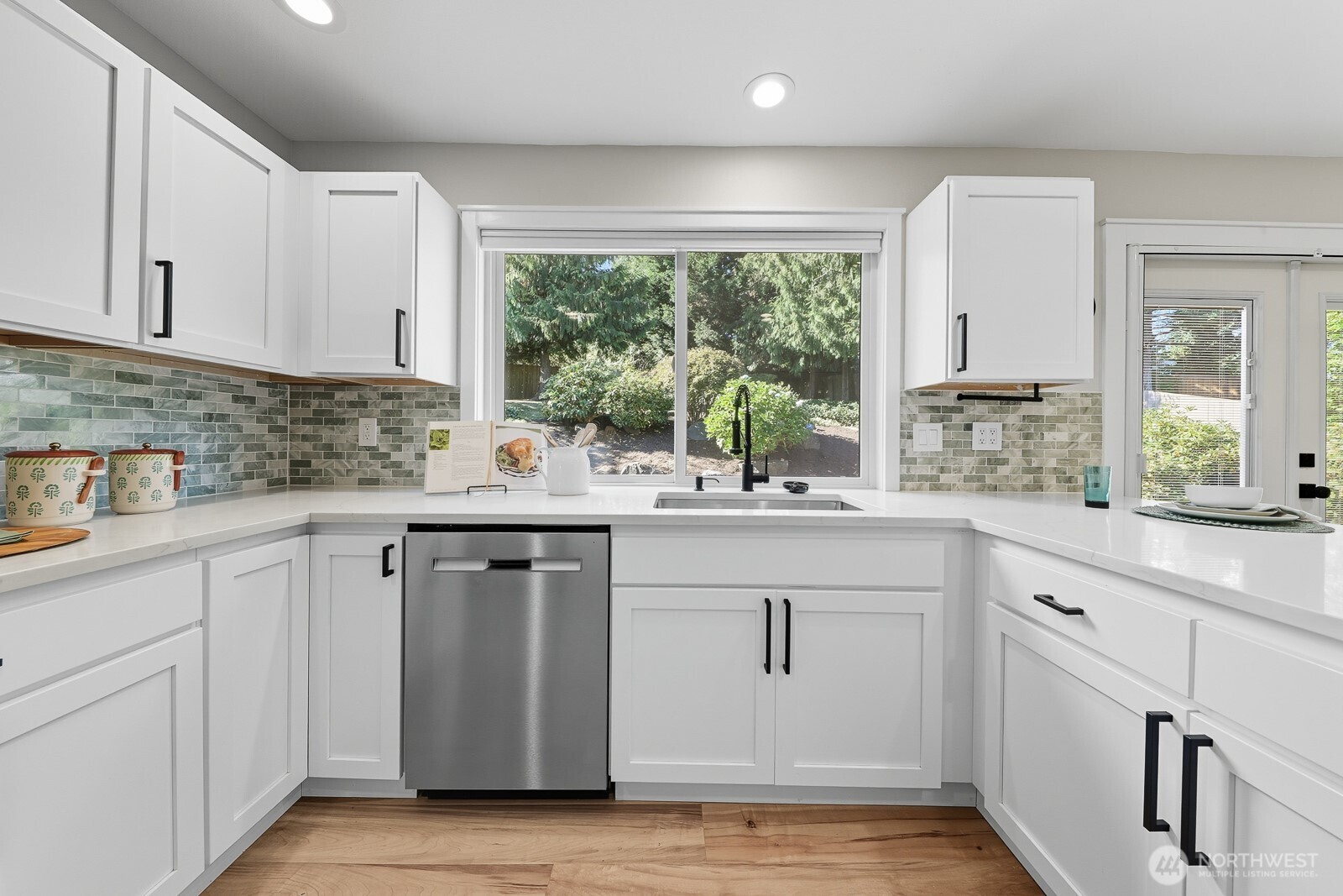 2750 214th Street Southwest Brier, WA 98036 - Photo 12 of 39 a kitchen with white cabinets and a window