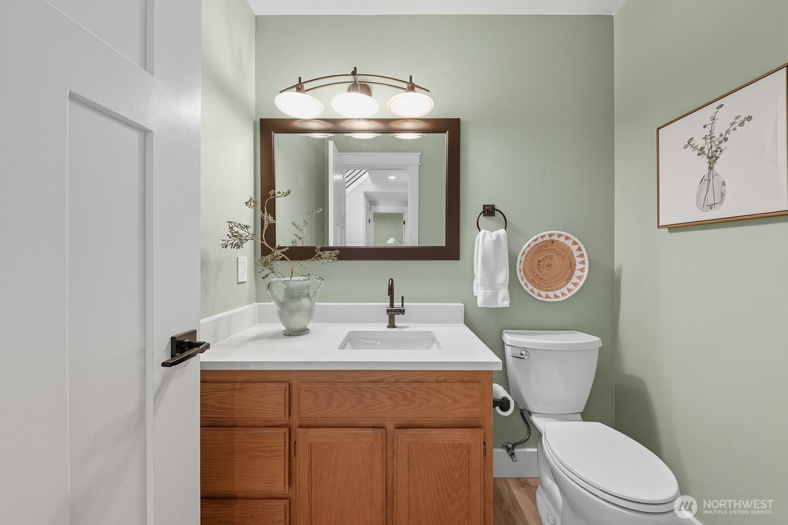 2750 214th Street Southwest Brier, WA 98036 - Photo 18 of 39 a bathroom with a toilet a sink and a mirror