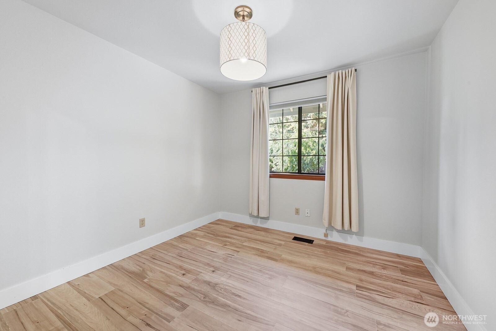 2750 214th Street Southwest Brier, WA 98036 - Photo 30 of 39 wooden floor in an empty room with a window
