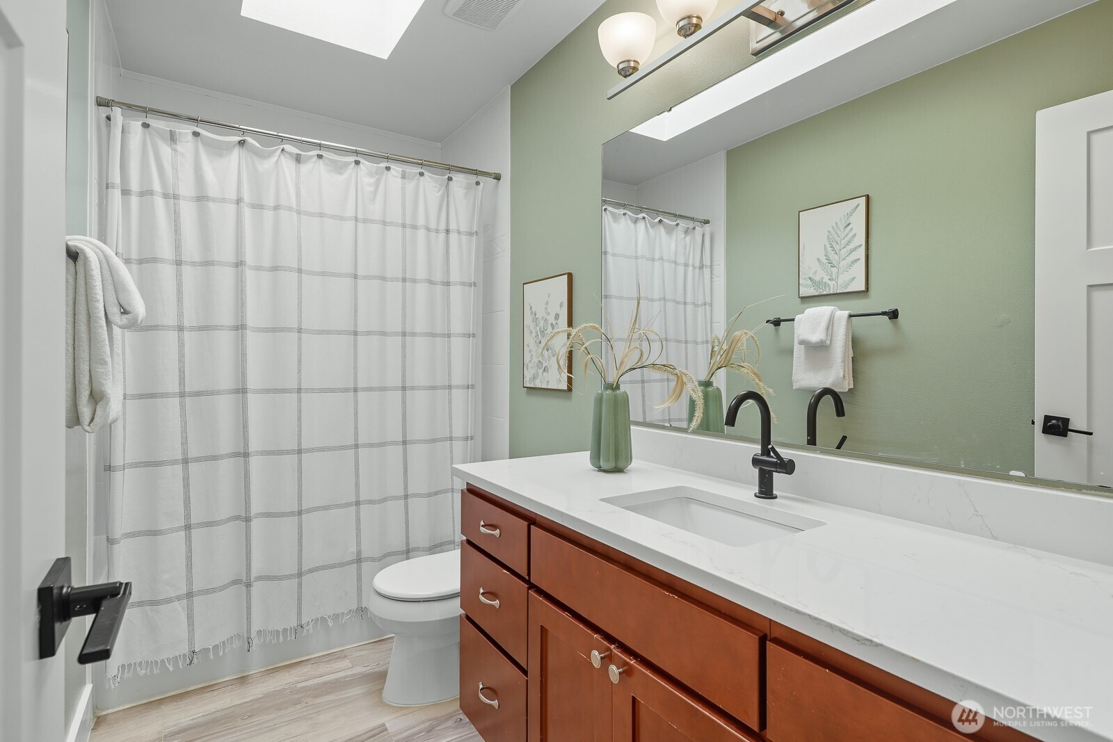 2750 214th Street Southwest Brier, WA 98036 - Photo 31 of 39 a bathroom with a sink a toilet and shower