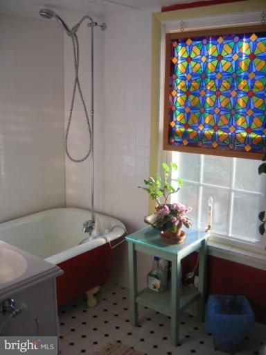 3808 Beckleysville Road Hampstead, MD 21074 - Photo 17 of 28 a bath room with a table and a couch