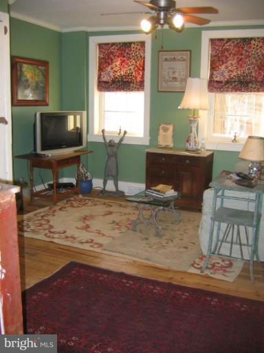 3808 Beckleysville Road Hampstead, MD 21074 - Photo 18 of 28 a living room with furniture and a flat screen tv