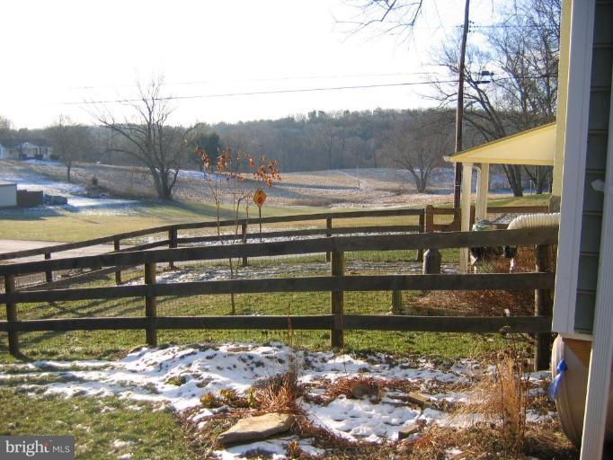 3808 Beckleysville Road Hampstead, MD 21074 - Photo 24 of 28 a view of a yard with wooden fence