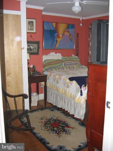 3808 Beckleysville Road Hampstead, MD 21074 - Photo 4 of 28 a bed sitting in a bedroom next to a window