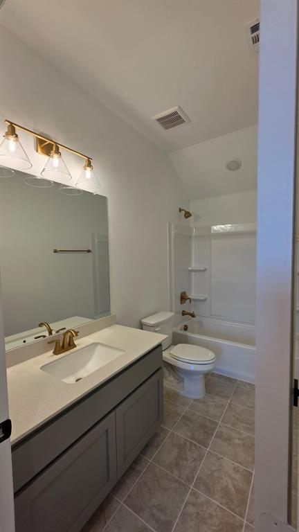 4201 Watson Way North Richland Hills, TX 76180 - Photo 16 of 40 a bathroom with a sink a toilet and mirror