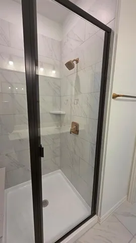 a spacious bathroom with a double vanity sink and a mirror