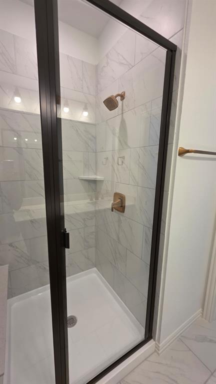 4201 Watson Way North Richland Hills, TX 76180 - Photo 22 of 40 a bathroom with a glass shower door