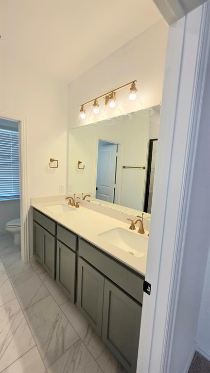 4201 Watson Way North Richland Hills, TX 76180 - Photo 23 of 40 a spacious bathroom with a double vanity sink and a mirror