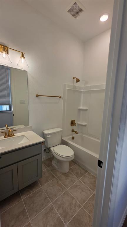 4201 Watson Way North Richland Hills, TX 76180 - Photo 32 of 40 a bathroom with a sink a toilet and shower