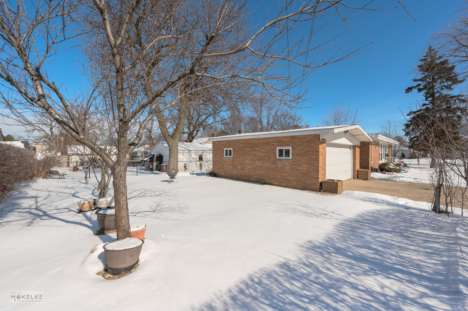 44 Iowa Avenue Addison, IL 60101 - Photo 27 of 31 a house view with a bench
