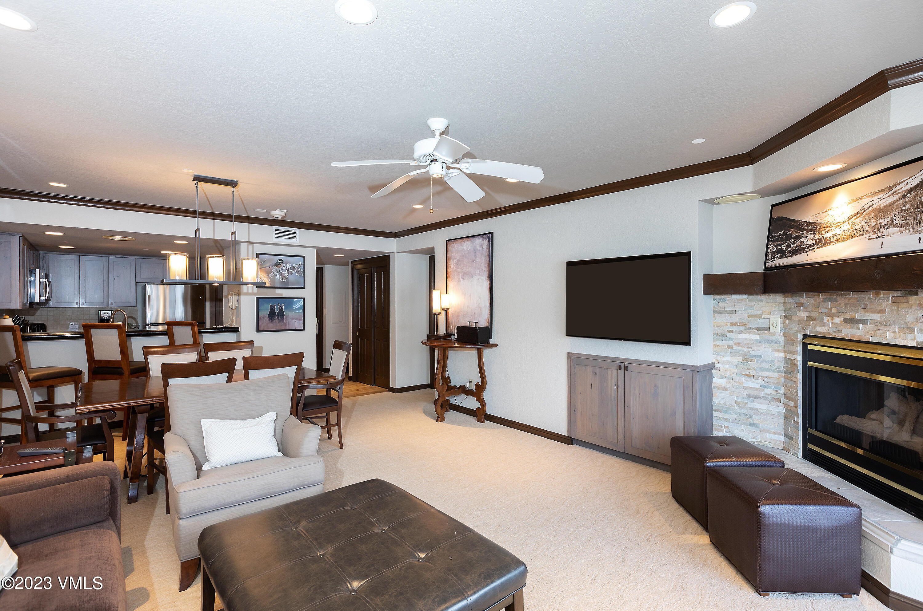 210 Offerson Road, Unit 207 WEEK 34 Beaver Creek, CO 81620 - Photo 5 of 26 a living room with furniture a flat screen tv and a fireplace