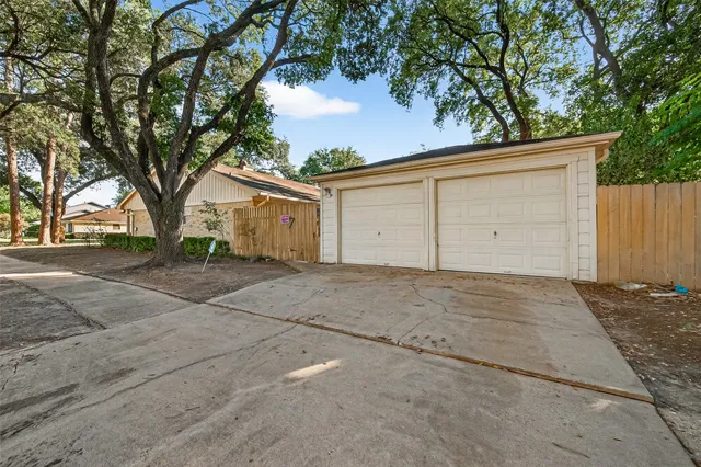 a view of garage yard and tree