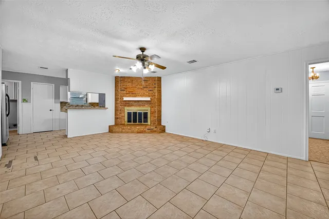 a view of a kitchen with a sink and a refrigerator cabinets