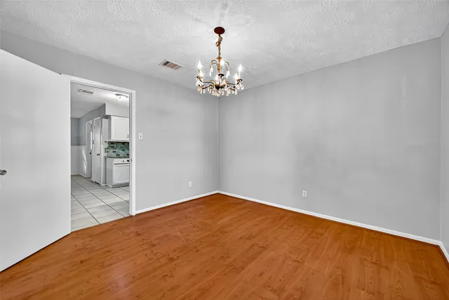 a view of a chandelier in an empty room