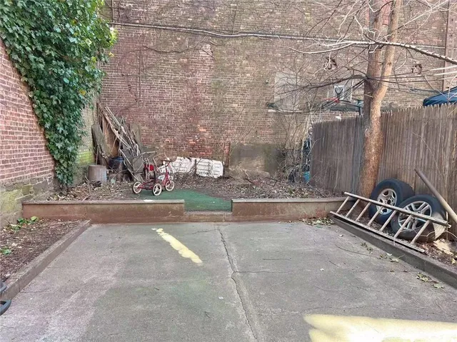 a view of a street with a building in the background