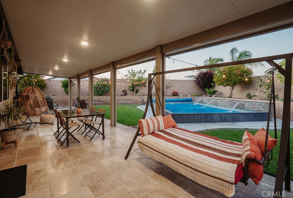 829 South Pine Avenue Rialto, CA 92376 - Photo 8 of 48 Travertine flooring/ recessed lighting in patio that overlooks the pool.